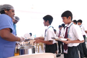 Students enjoying fresh organic meals at Aadya Academy, the best residential school in North Bangalore.