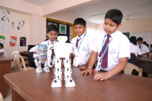 Students working in advanced Robotics and AI labs at Aadya Academy, the best residential school in North Bangalore.